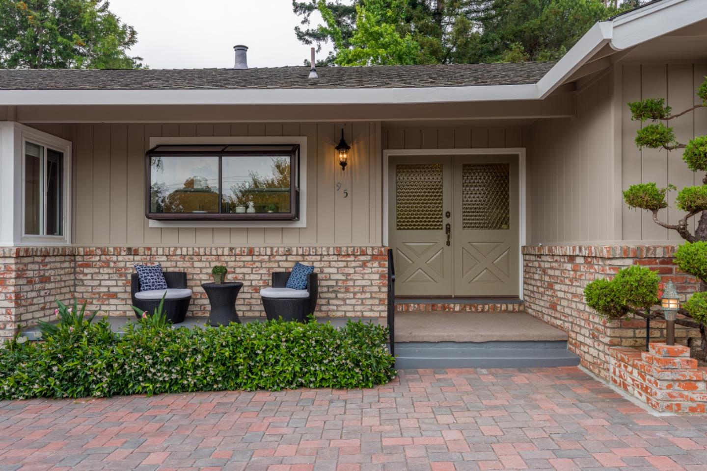 95 Avondale Road Hillsborough, CA 94010 - Photo 2 of 25 a front view of a house with outdoor seating