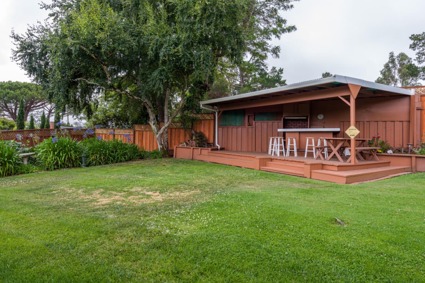 95 Avondale Road Hillsborough, CA 94010 - Photo 22 of 25 a view of a chair and table in the garden