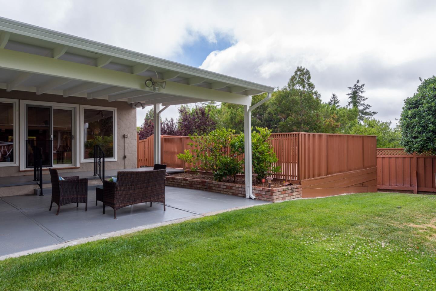 95 Avondale Road Hillsborough, CA 94010 - Photo 23 of 25 a view of a house with a yard and sitting area