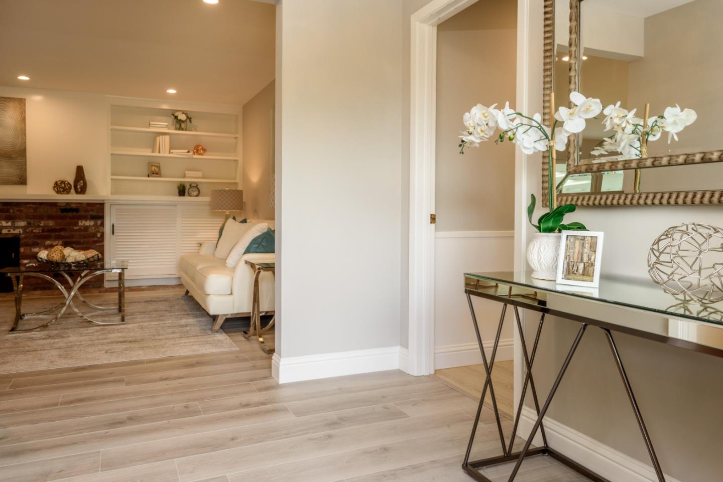 95 Avondale Road Hillsborough, CA 94010 - Photo 3 of 25 a view of a dining room with furniture and wooden floor