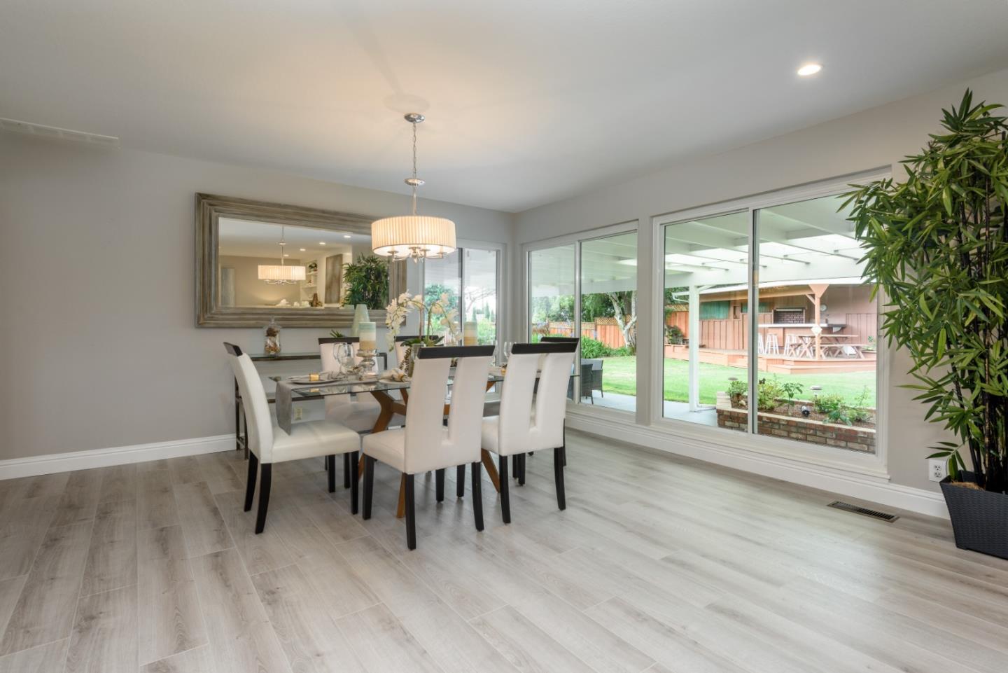 95 Avondale Road Hillsborough, CA 94010 - Photo 7 of 25 a view of a dining room with furniture and window
