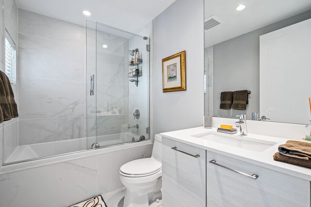 a bathroom with a sink a toilet and a bathtub