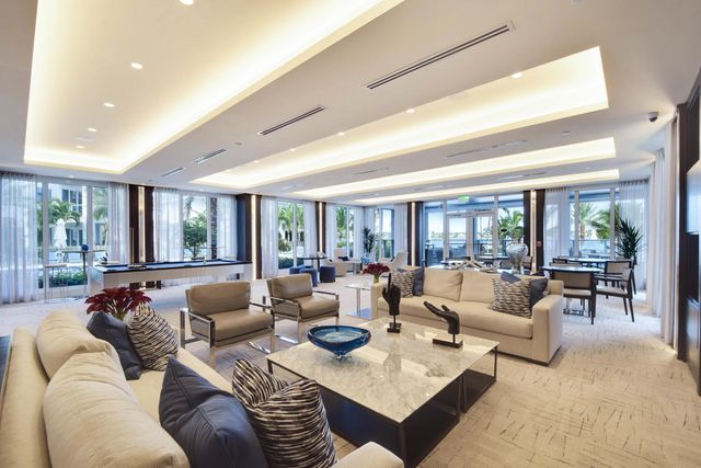 a large kitchen with a table and chairs in it