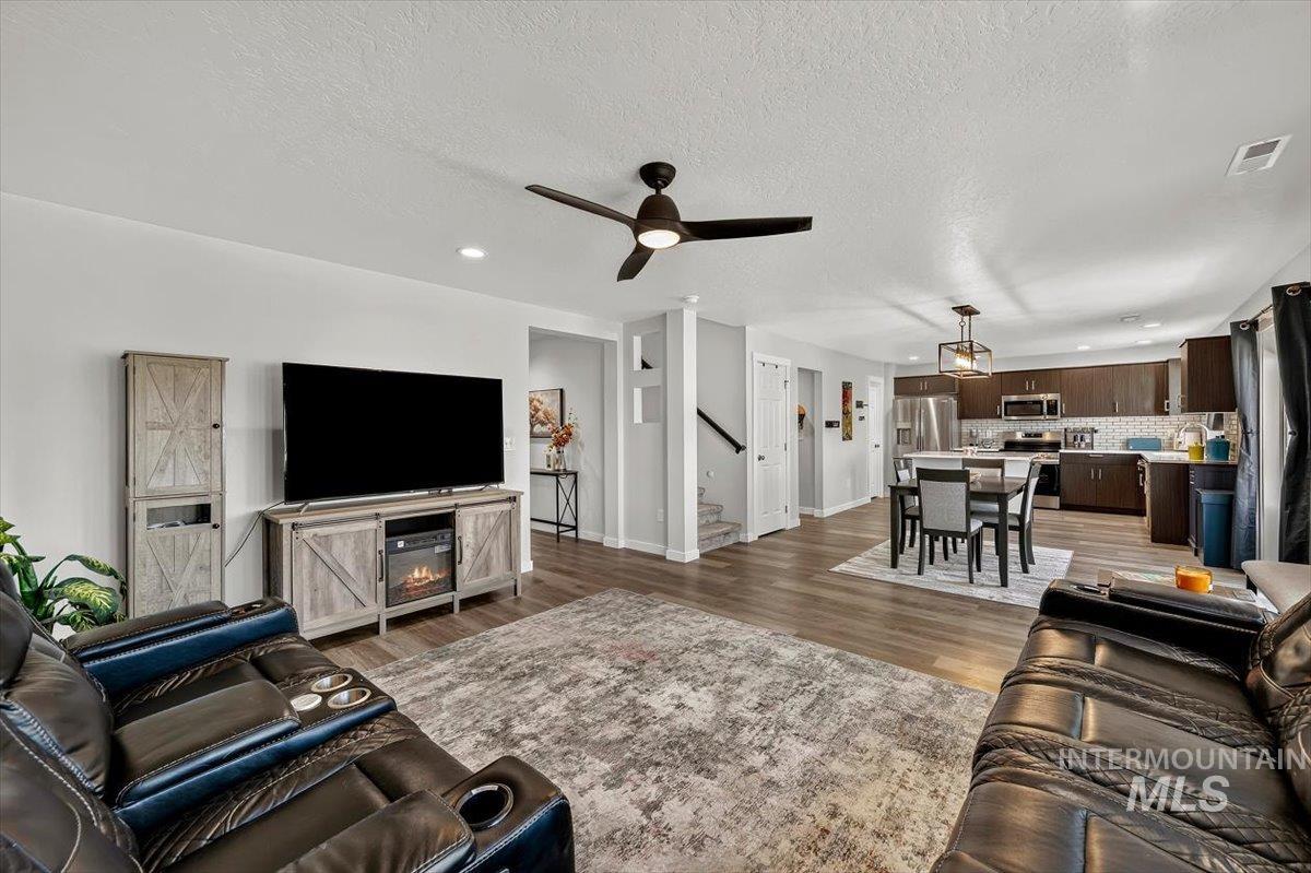 8575 South Foraker Way Kuna, ID 83634 - Photo 8 of 43 Open-concept living space with dining and kitchen