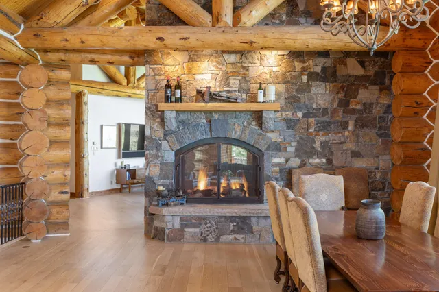 a spacious bedroom with a bed and a fireplace