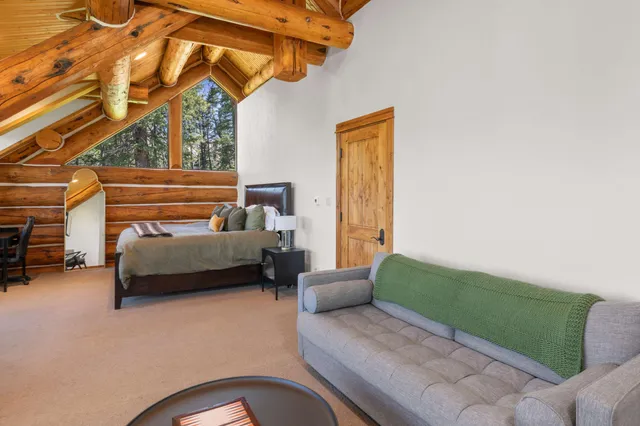 a bathroom with a double vanity sink mirror and shower