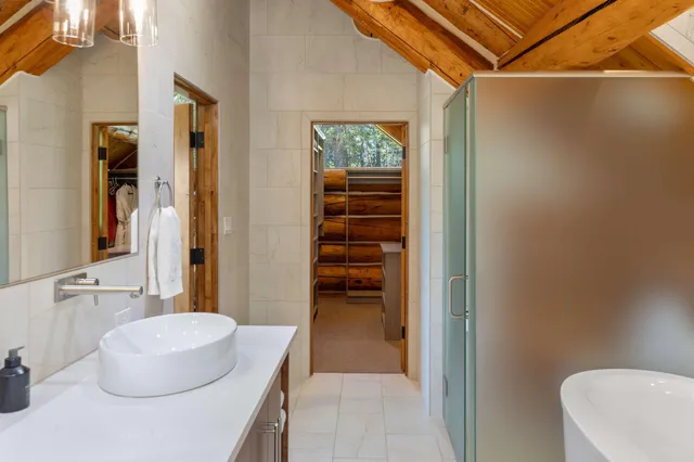 a kitchen with a stove and a wooden floor