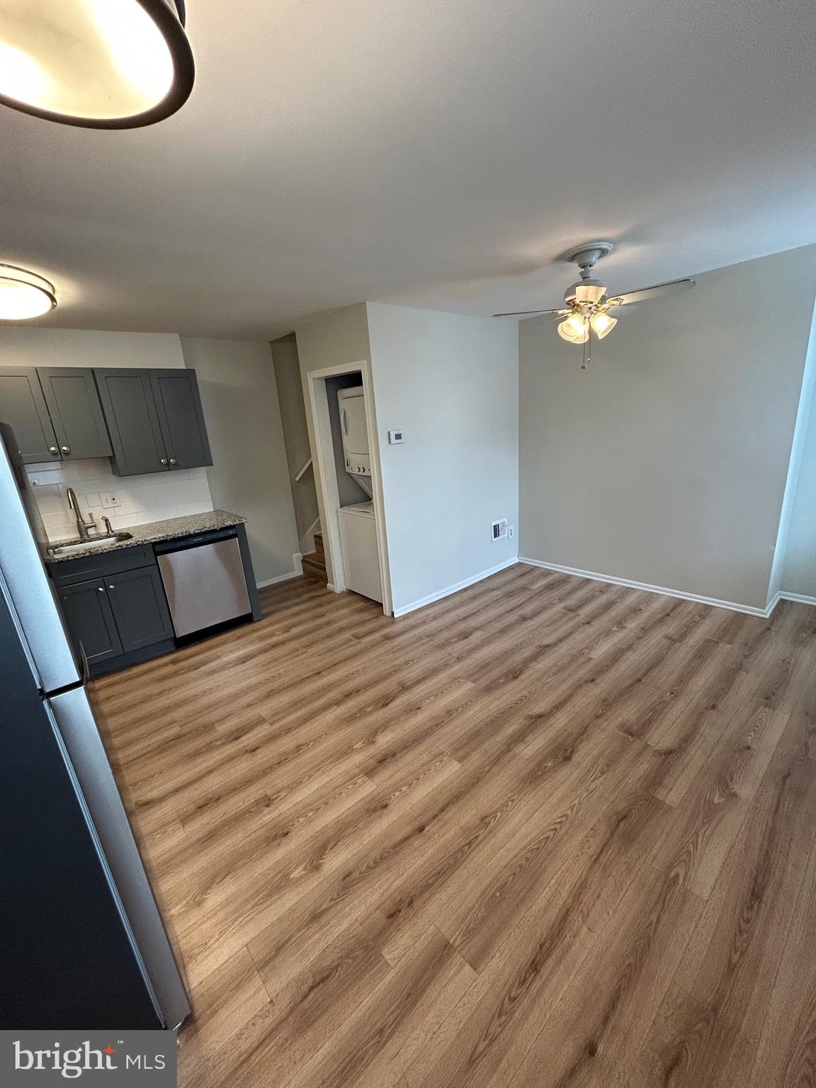 521 South Wolfe Street, Unit 1F Baltimore, MD 21231 - Photo 3 of 10 a bedroom with a bed and a chandelier