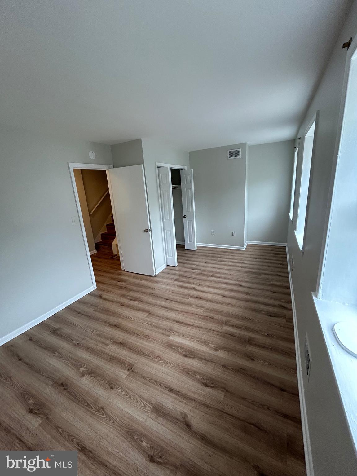 521 South Wolfe Street, Unit 1F Baltimore, MD 21231 - Photo 7 of 10 a view of a hallway with wooden floor