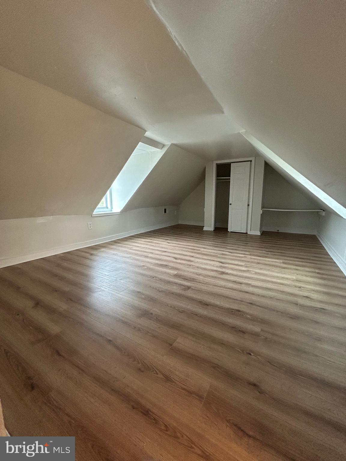 521 South Wolfe Street, Unit 1F Baltimore, MD 21231 - Photo 9 of 10 a view of empty room with wooden floor