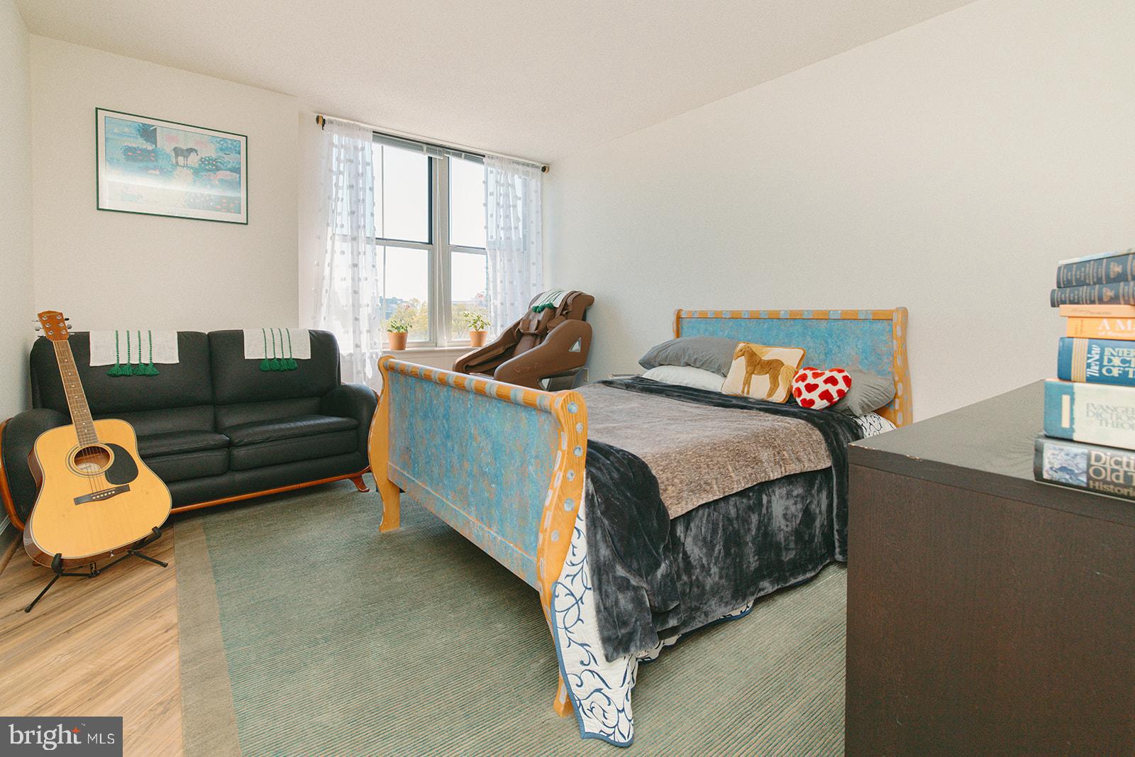 11800 Sunset Hills Road, Unit 506 Reston, VA 20190 - Photo 16 of 30 a bed room with couch and a window