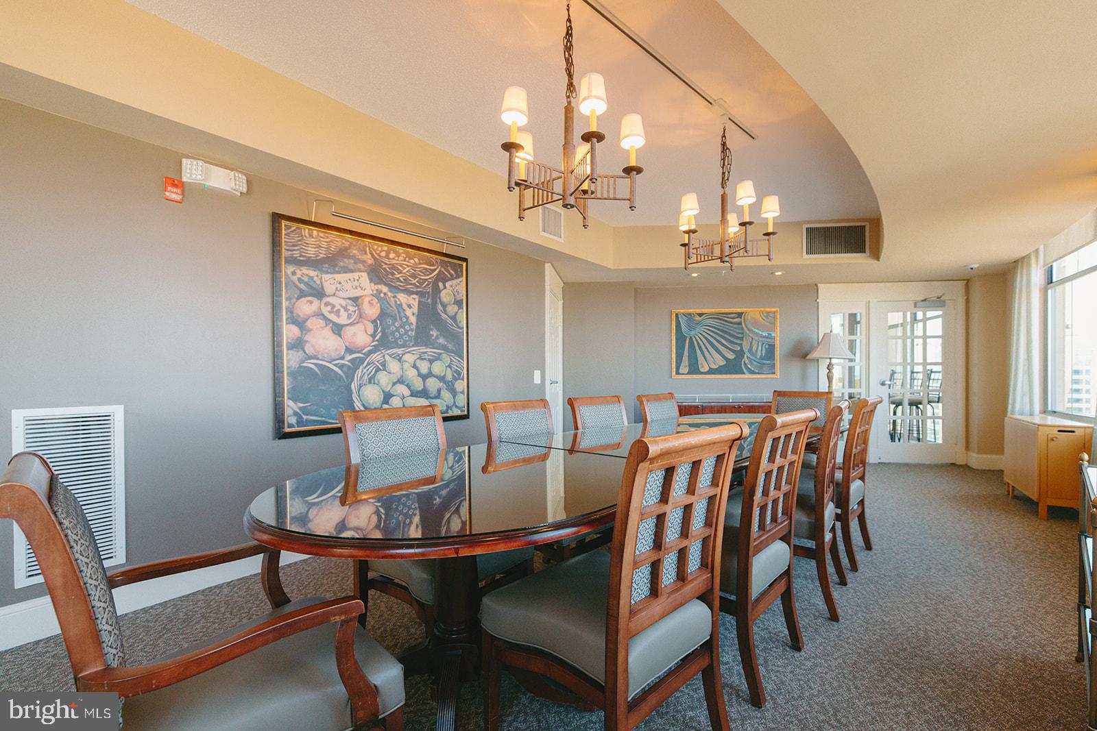 11800 Sunset Hills Road, Unit 506 Reston, VA 20190 - Photo 24 of 30 a view of a dining room with furniture and chandelier