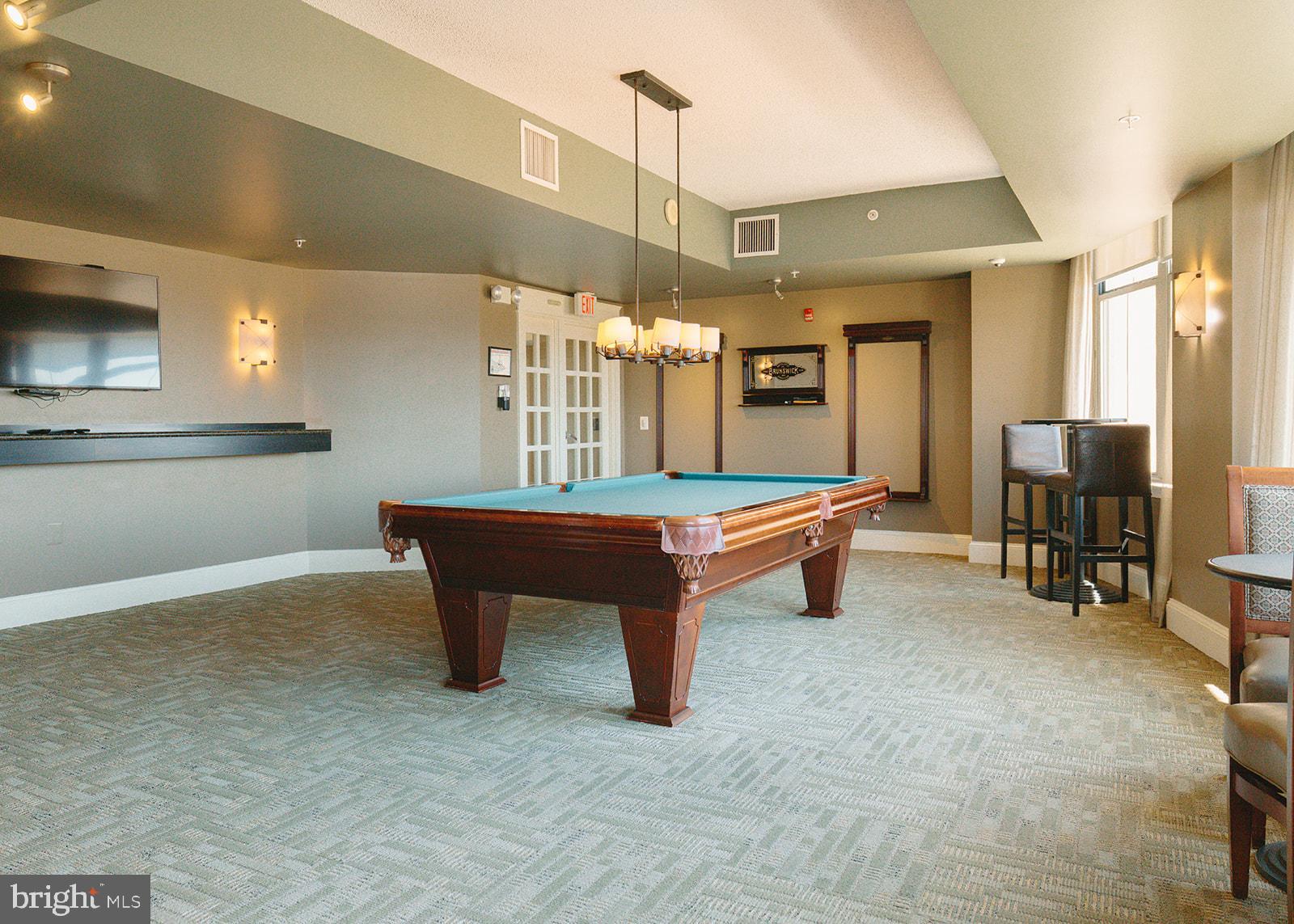 11800 Sunset Hills Road, Unit 506 Reston, VA 20190 - Photo 27 of 30 a room with furniture pool table and flat screen tv