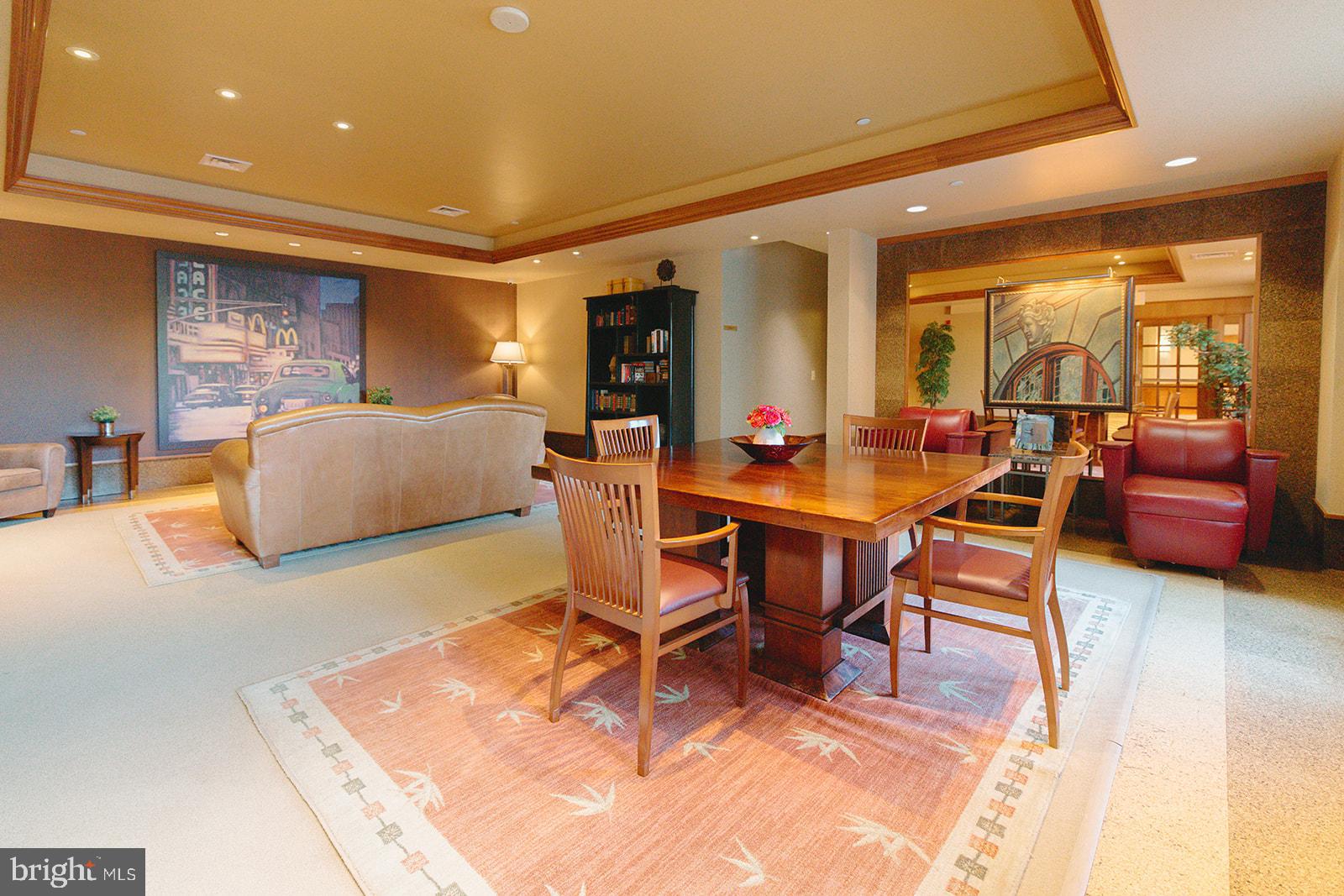 11800 Sunset Hills Road, Unit 506 Reston, VA 20190 - Photo 30 of 30 a living room with furniture and a table