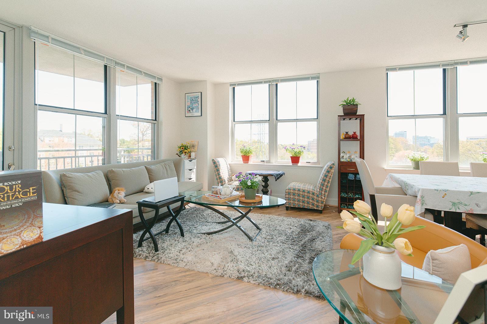 11800 Sunset Hills Road, Unit 506 Reston, VA 20190 - Photo 4 of 30 a living room with furniture and a large window