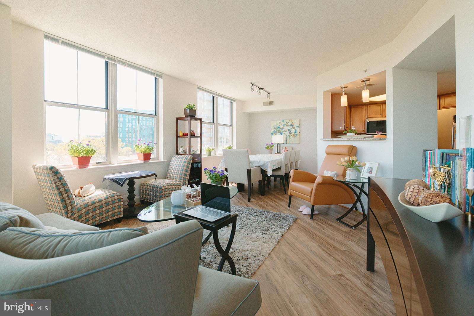 11800 Sunset Hills Road, Unit 506 Reston, VA 20190 - Photo 6 of 30 a living room with furniture and a large window