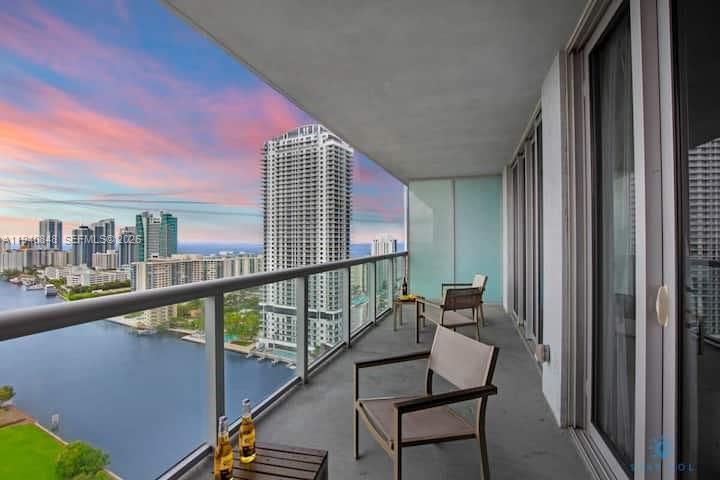 2602 East Hallandale Beach Boulevard, Unit R2006 Hallandale Beach, FL 33009 - Photo 20 of 24 a view of a balcony with furniture