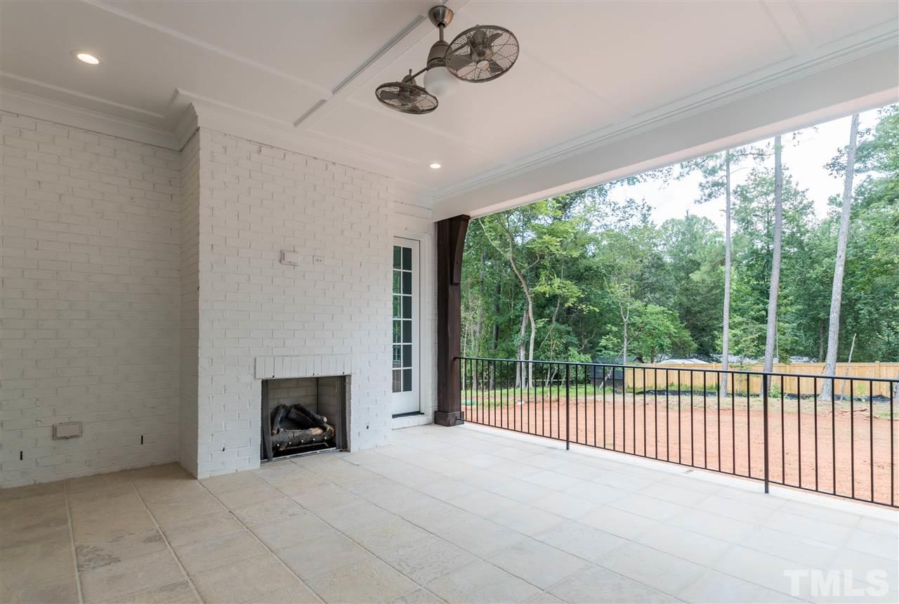 5412 Winding View Lane Raleigh, NC 27615 - Photo 2 of 30 a view of an empty room with a fireplace and a window