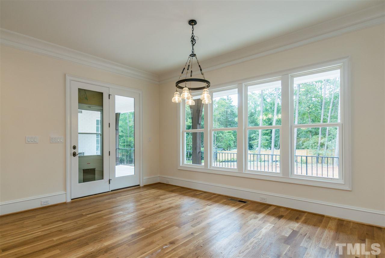 5412 Winding View Lane Raleigh, NC 27615 - Photo 11 of 30 a view of an empty room with wooden floor and a window