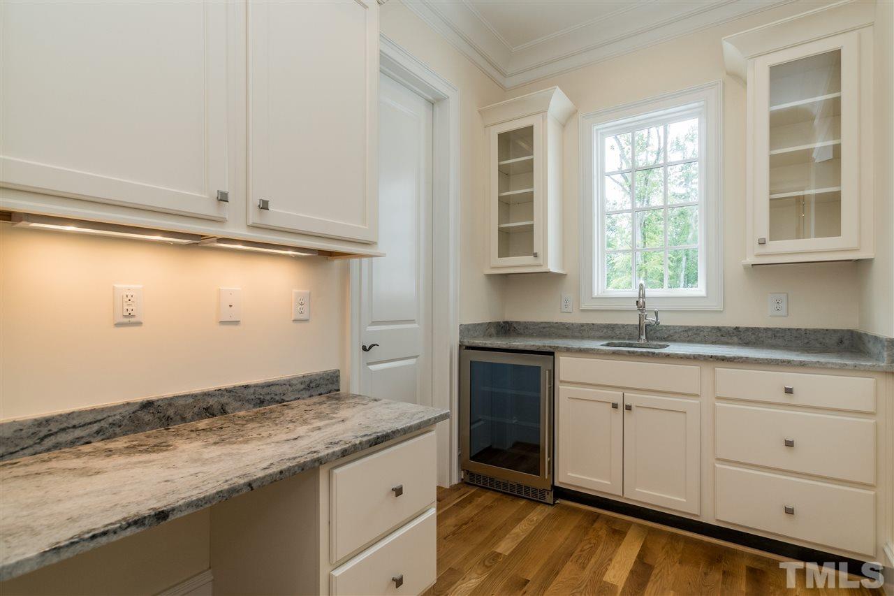 5412 Winding View Lane Raleigh, NC 27615 - Photo 12 of 30 a kitchen with granite countertop cabinets stainless steel appliances and a window