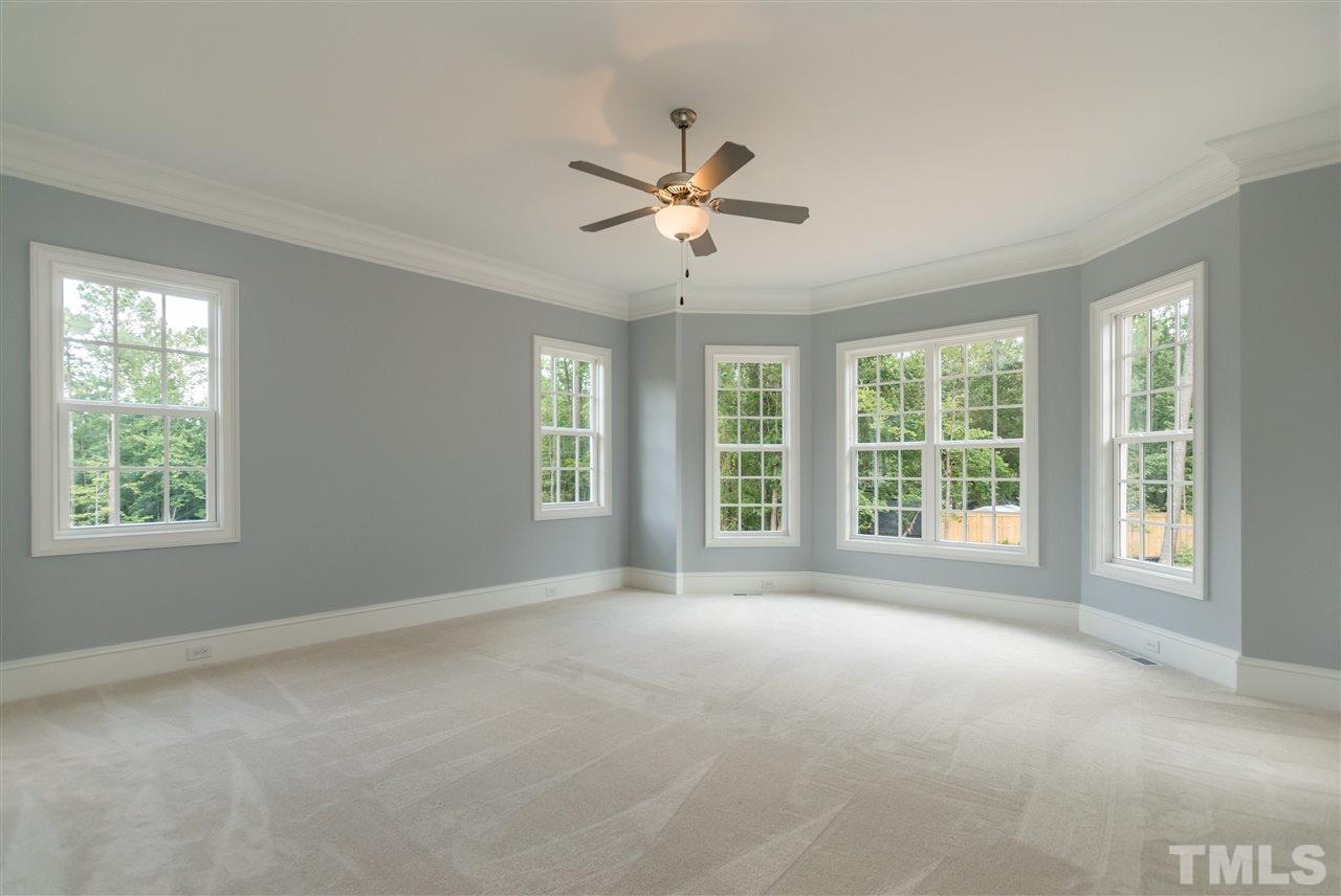 5412 Winding View Lane Raleigh, NC 27615 - Photo 14 of 30 a view of a livingroom with a ceiling fan and window