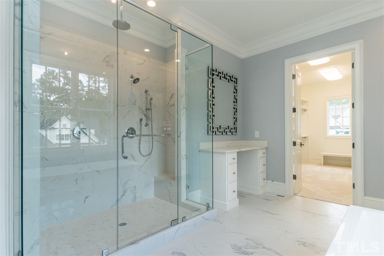 5412 Winding View Lane Raleigh, NC 27615 - Photo 16 of 30 a bathroom with a shower and a sink