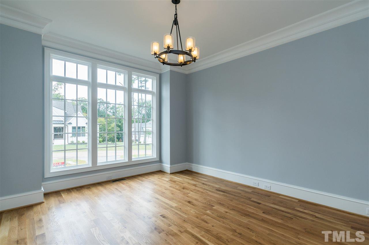 5412 Winding View Lane Raleigh, NC 27615 - Photo 20 of 30 a view of a room with wooden floor and chandelier