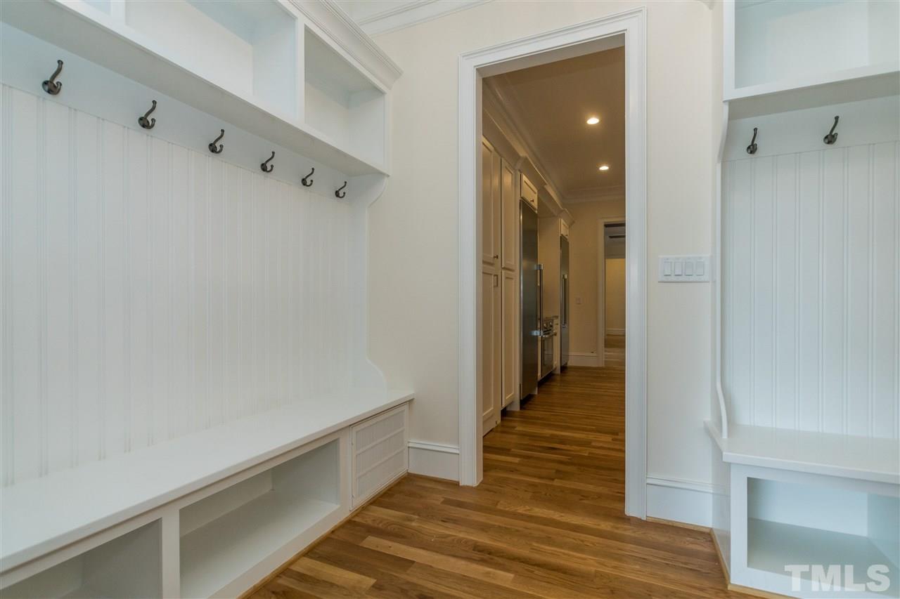 5412 Winding View Lane Raleigh, NC 27615 - Photo 22 of 30 a hallway with wooden floor and staircase