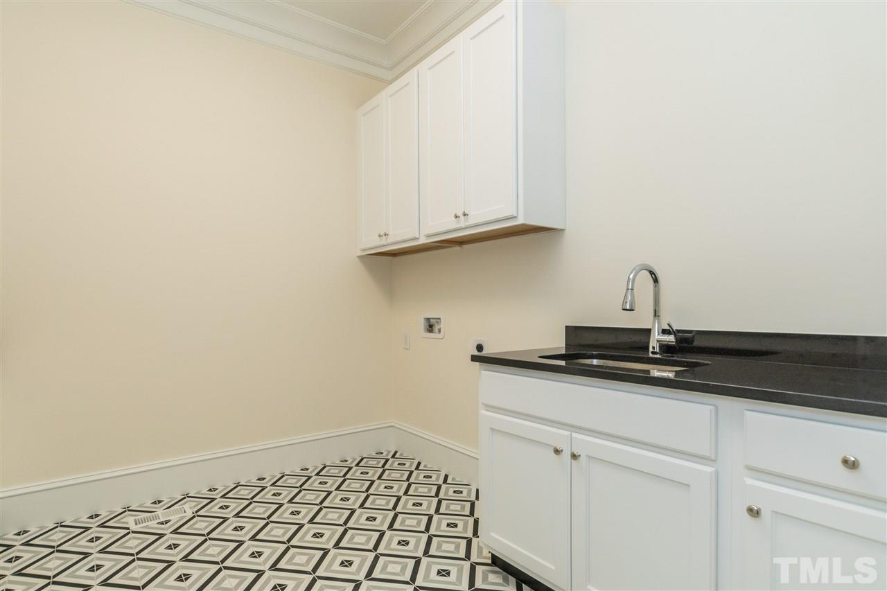5412 Winding View Lane Raleigh, NC 27615 - Photo 23 of 30 a kitchen with a sink and cabinets