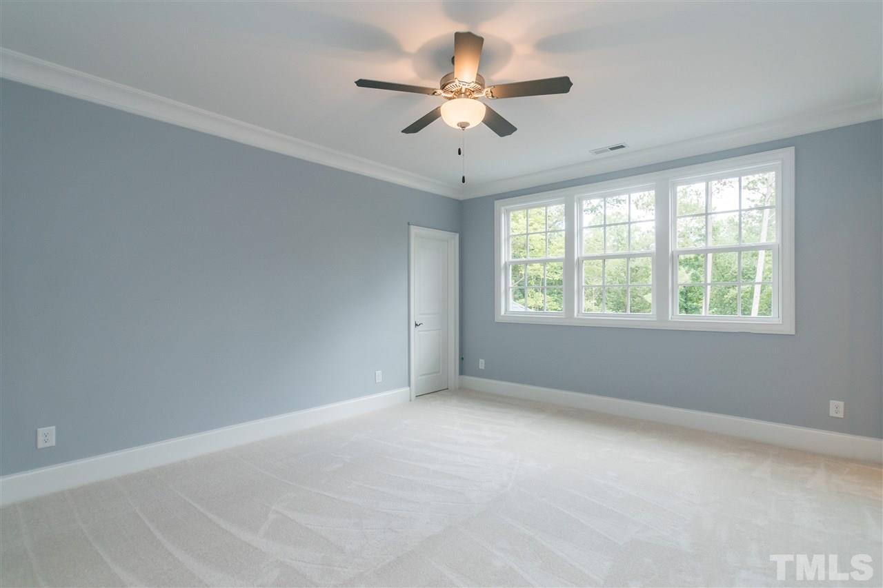 5412 Winding View Lane Raleigh, NC 27615 - Photo 25 of 30 an empty room with a window and a fan
