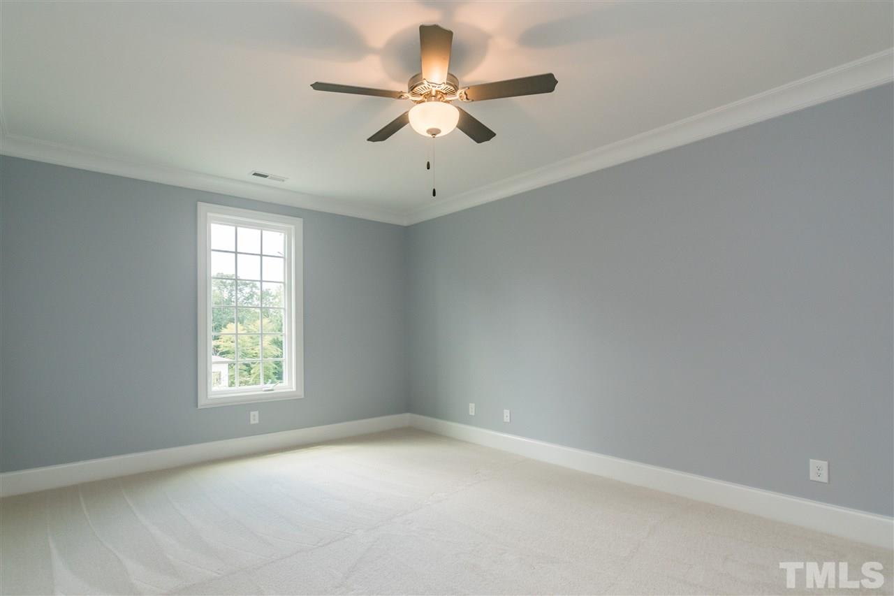 5412 Winding View Lane Raleigh, NC 27615 - Photo 26 of 30 an empty room with a window and a fan
