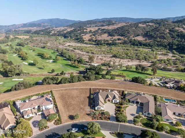 an aerial view of a house with a garden