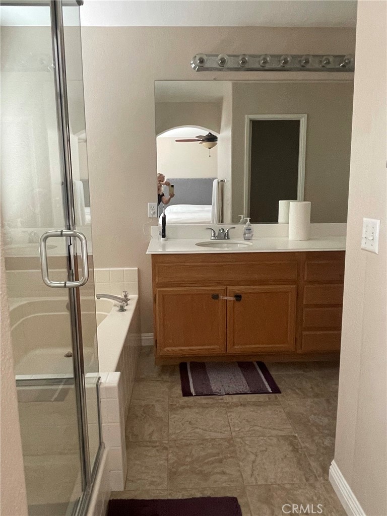 43093 Teramo Street Temecula, CA 92592 - Photo 8 of 13 a bathroom with a sink and a mirror
