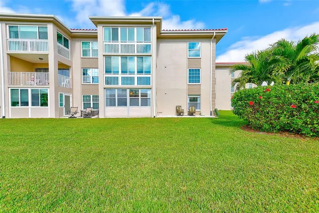 a bedroom with two beds and a window