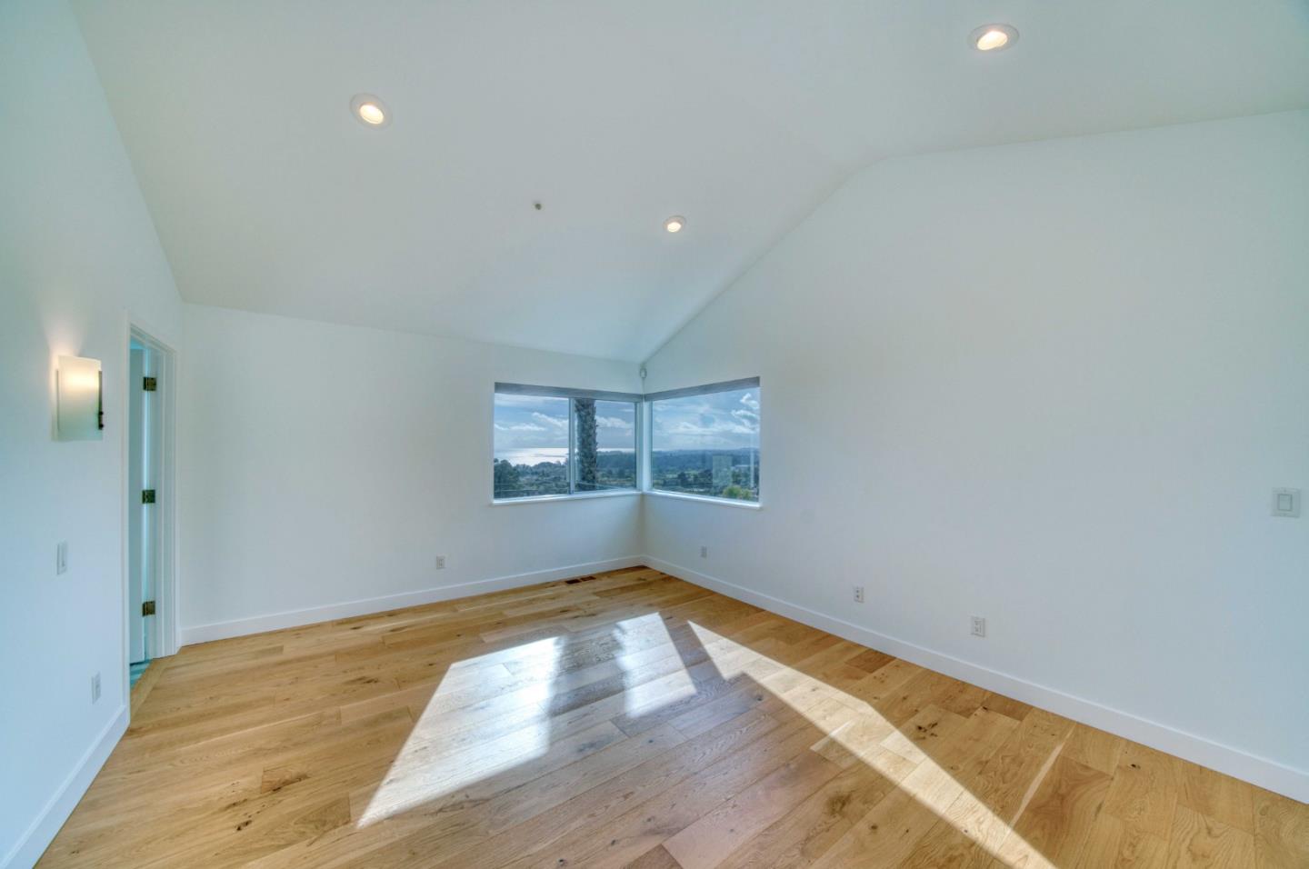 7325 Viewpoint Road Aptos, CA 95003 - Photo 38 of 51 an empty room with wooden floor and windows