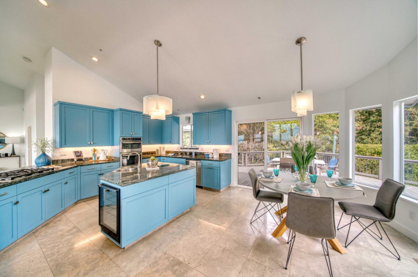 7325 Viewpoint Road Aptos, CA 95003 - Photo 7 of 51 a kitchen with lots of counter space windows and a chandelier