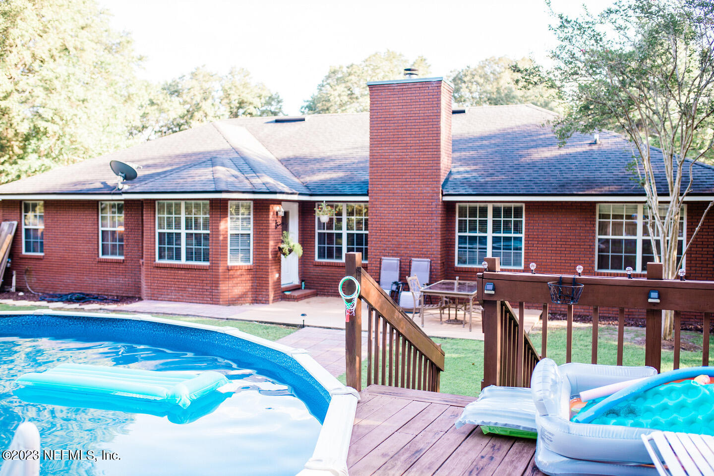55316 Deer Run Road Callahan, FL 32011 - Photo 25 of 32 front view of a house with a patio