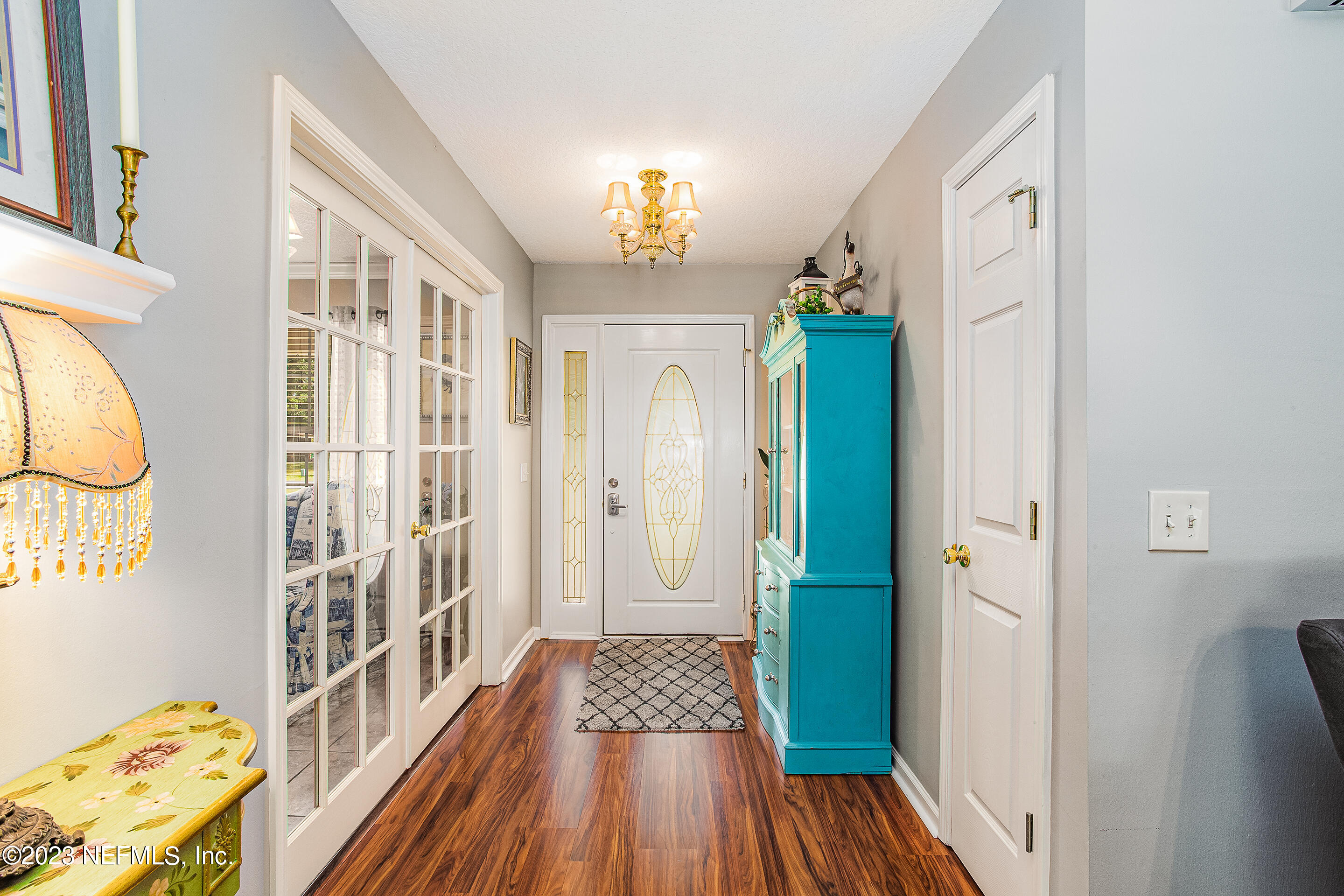 55316 Deer Run Road Callahan, FL 32011 - Photo 6 of 32 a view of a hallway view with wooden floor and staircase