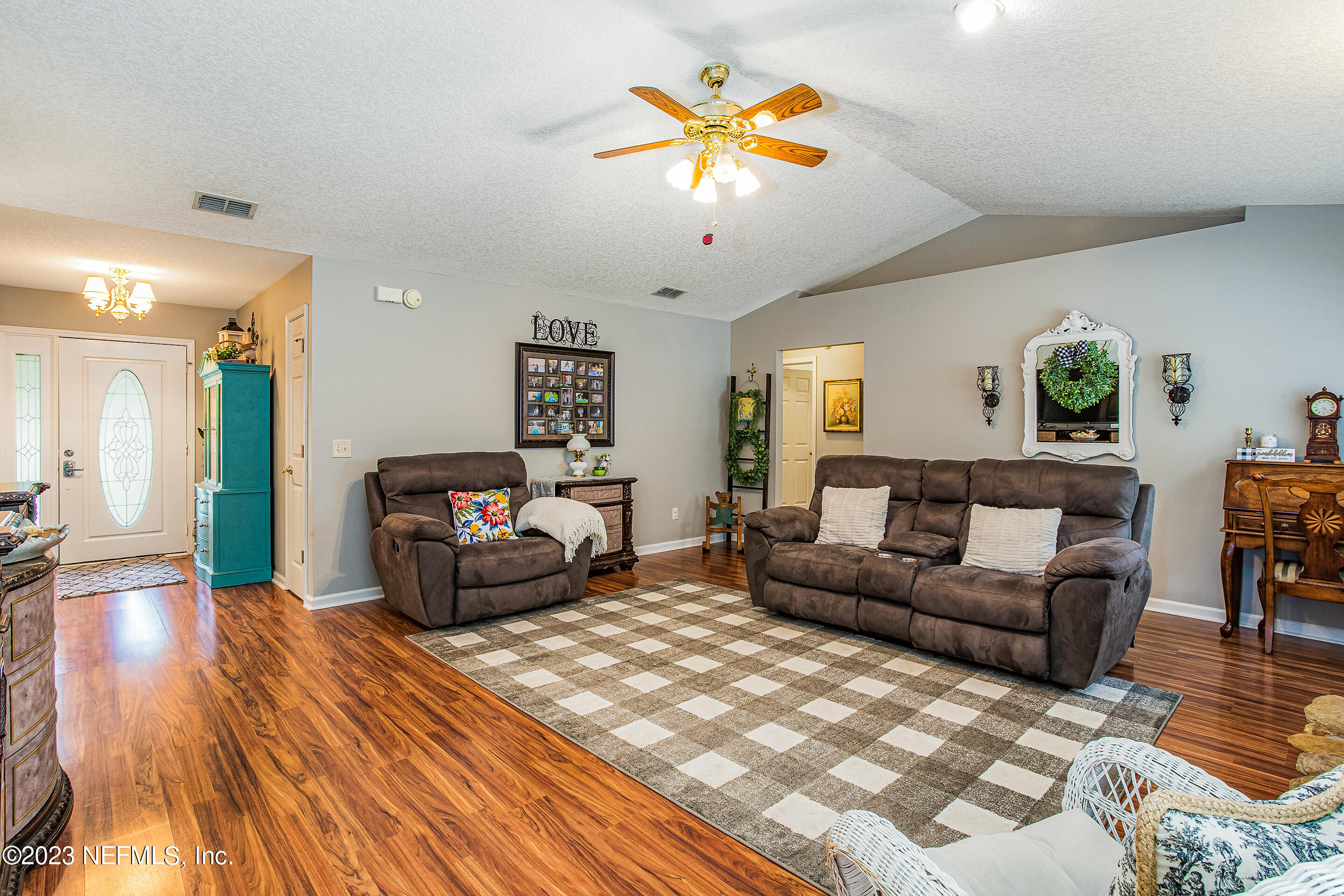 55316 Deer Run Road Callahan, FL 32011 - Photo 7 of 32 a living room with furniture and a flat screen tv
