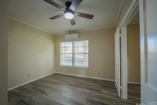 a bathroom with a shower and a glass door