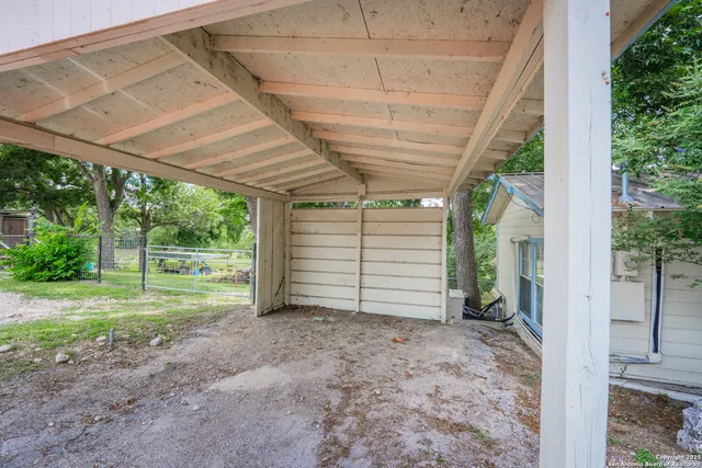 a view of a bench in a backyard