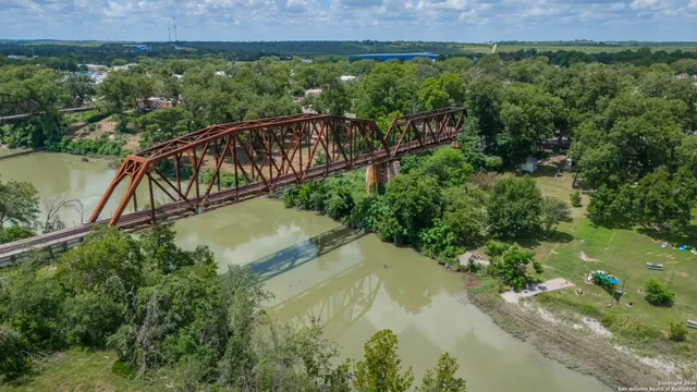 a view of a two chairs in the balcony