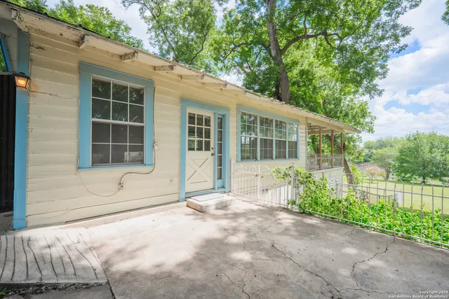 a house with trees in the background