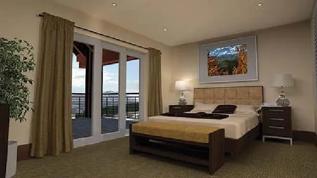 a spacious bedroom with a bed and a window