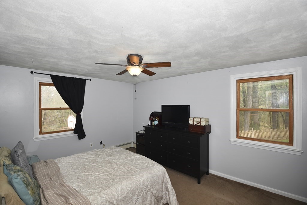 39 Tanglewood Road Sterling, MA 01564 - Photo 17 of 30 a bedroom with a bed and a window
