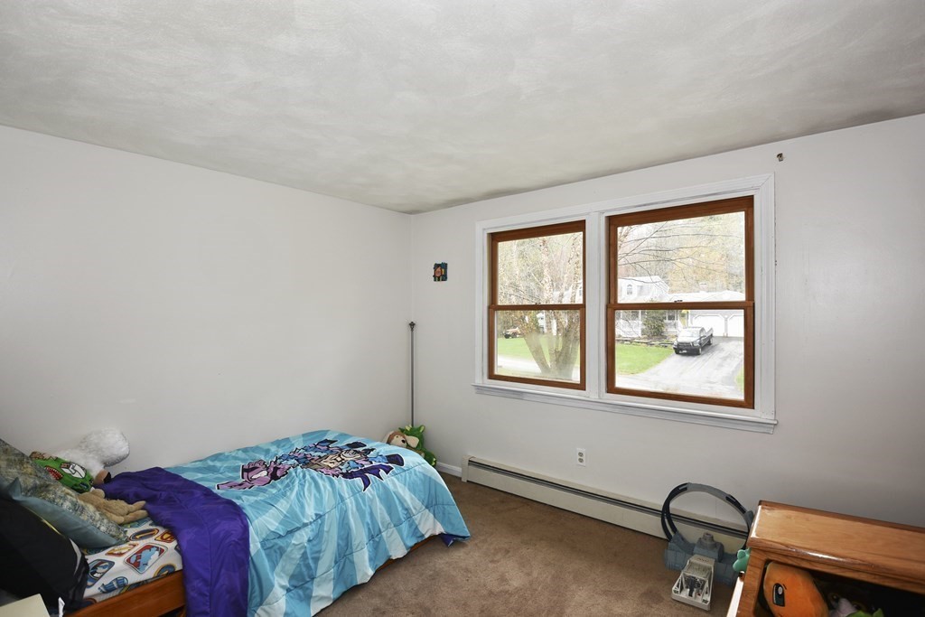 39 Tanglewood Road Sterling, MA 01564 - Photo 18 of 30 a bedroom with a bed and a window