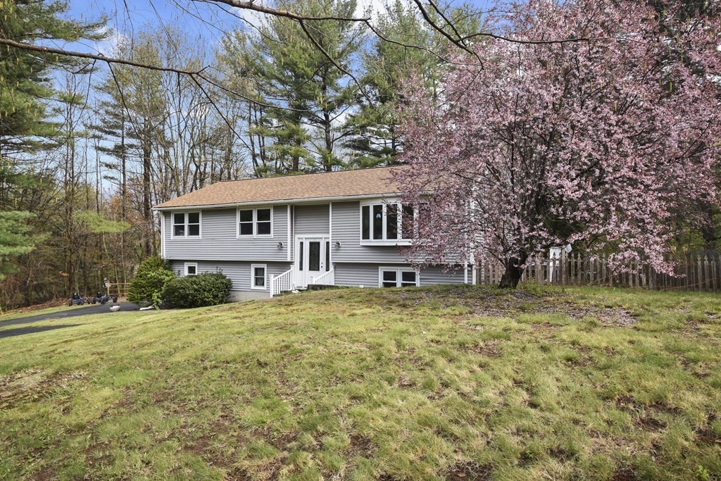 39 Tanglewood Road Sterling, MA 01564 - Photo 2 of 30 a view of a house with a yard