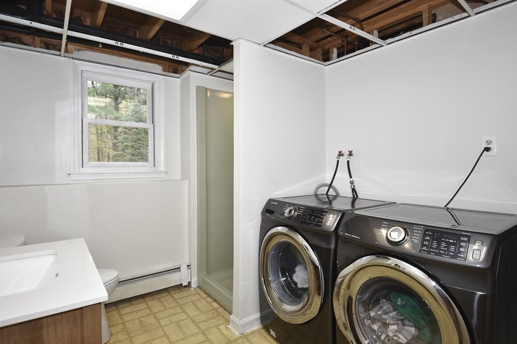 39 Tanglewood Road Sterling, MA 01564 - Photo 25 of 30 a utility room with dryer and washer