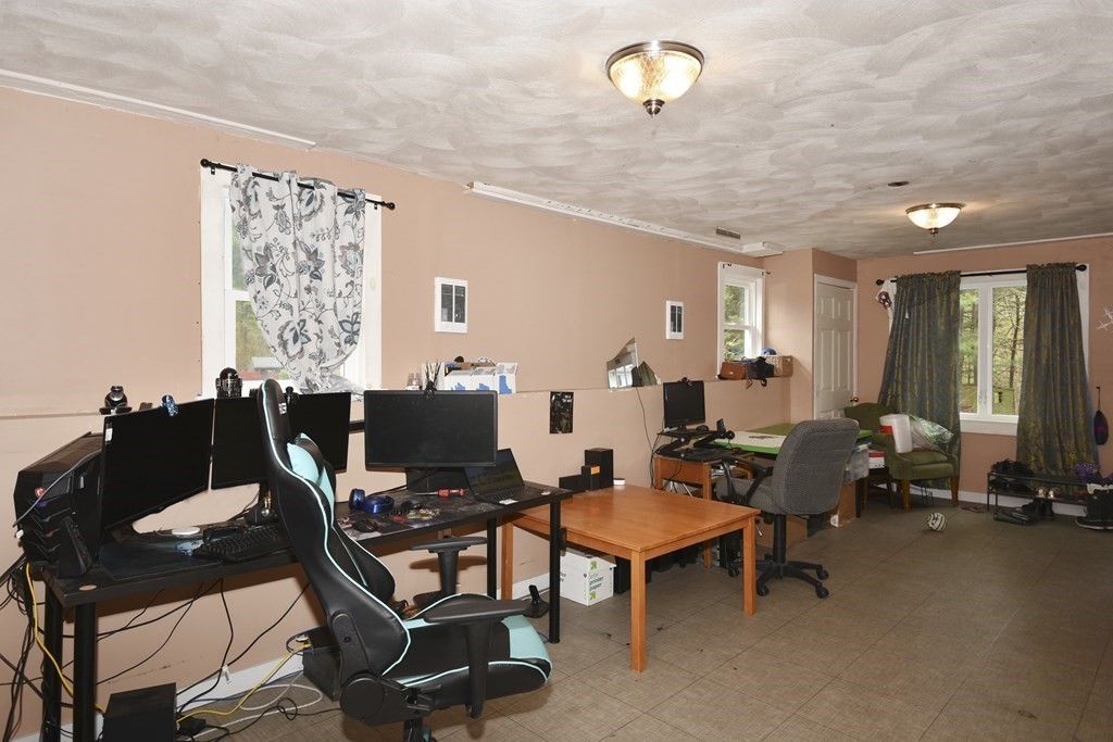 39 Tanglewood Road Sterling, MA 01564 - Photo 26 of 30 a living room with furniture a large window and a flat screen tv