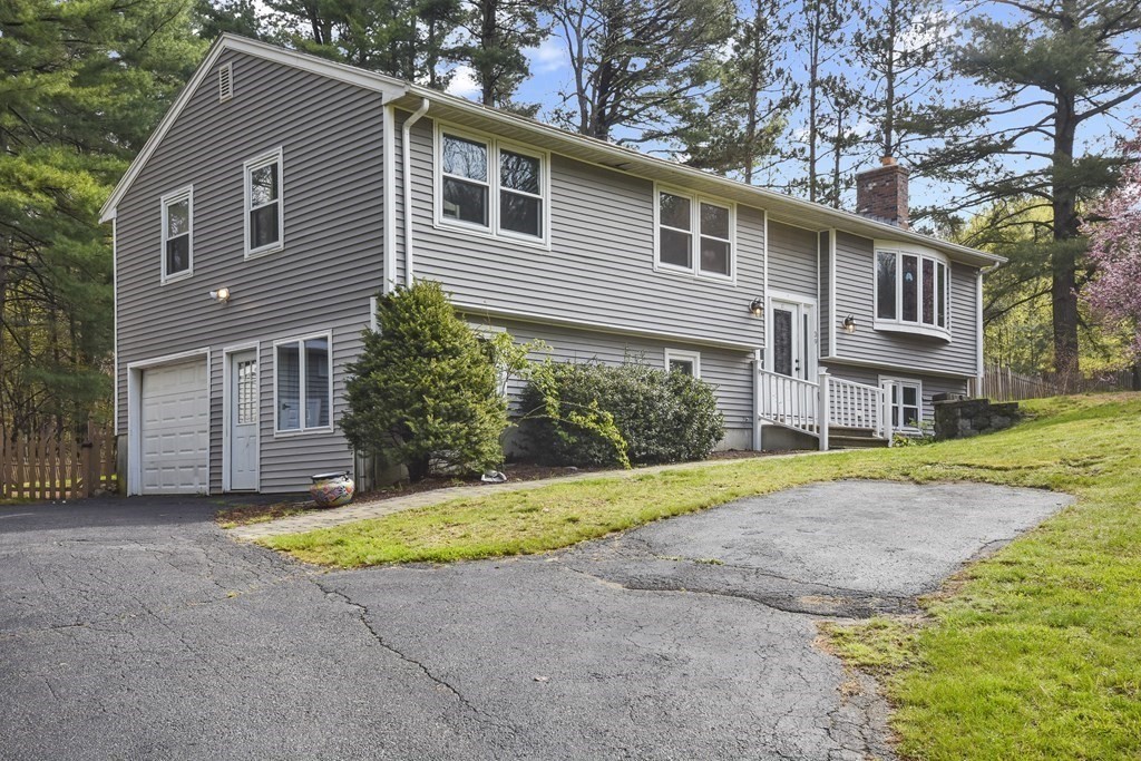 39 Tanglewood Road Sterling, MA 01564 - Photo 3 of 30 a view of a house with a yard and large tree